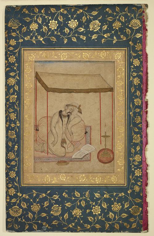 Drawing shows a man kneeling under a canopy, clutching red prayer beads in his left hand. The drawing is set inside a gold illuminated boarder, on a green page with the same gold floral illumination.