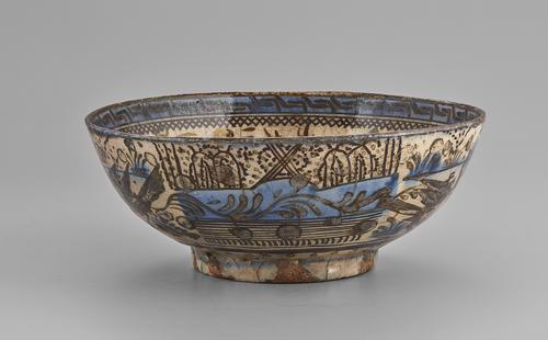 One of six panels two two scenes of approximately equal size on the exterior of this bowl. This scene shows a landscape consisting of streams, a rocky shore and a distant garden. The drawing is in brown on a cream ground with some light blue colouring for water and some elements of the landscape.