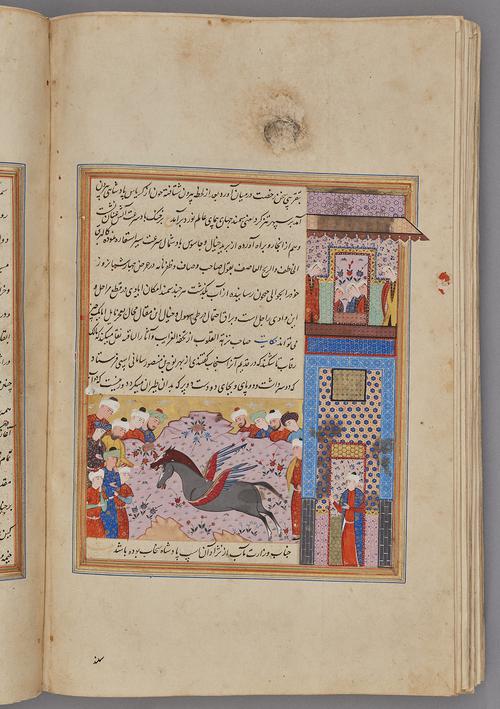  Painting within a rectangular border of blue, gold, green, and red, with 9 lines of script on the left side, figures marvel at a monstrous two-headed horse with wings.   