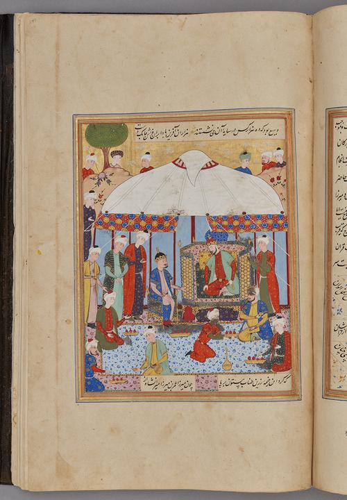 Painting within a rectangular border of blue, gold, green, and red, lines of script at the top and bottom. Audience standing around two crowned figures under a white tent.   