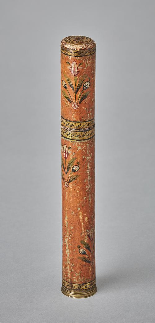 Cylindrical pen holder painted with floral designs and gold accents on orange background. 